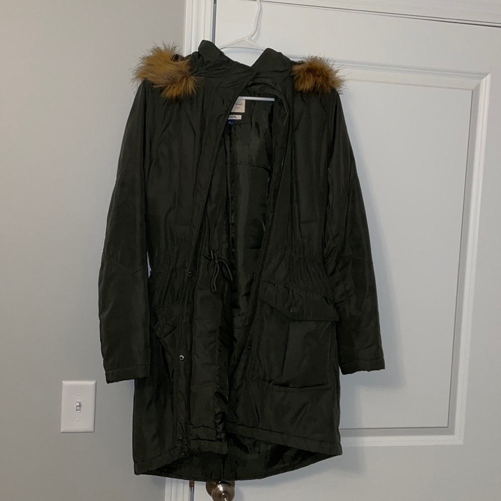 Green puffer coat